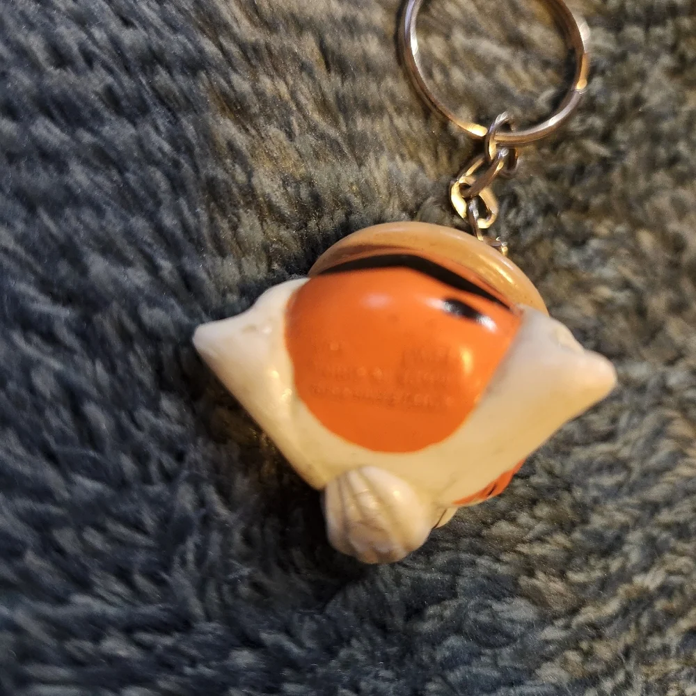 vintage 1997 Exxon Tiger promotional keychain, featuring the company's tiger